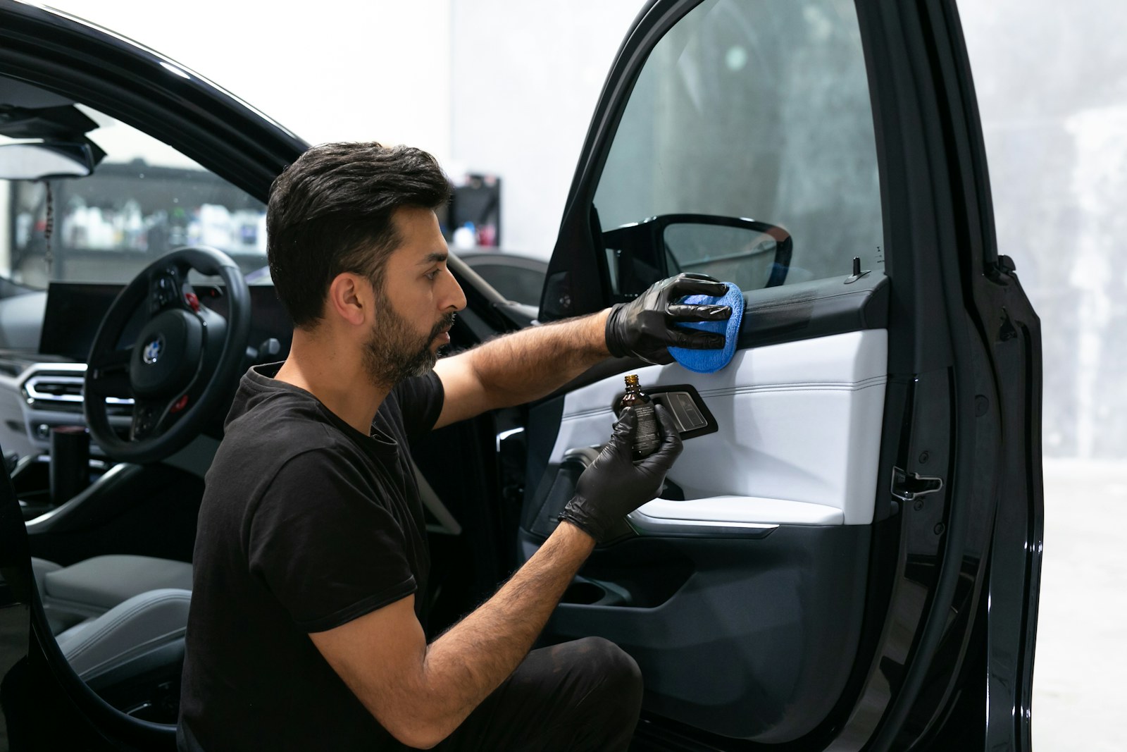 A vehicle interior being carefully cleaned